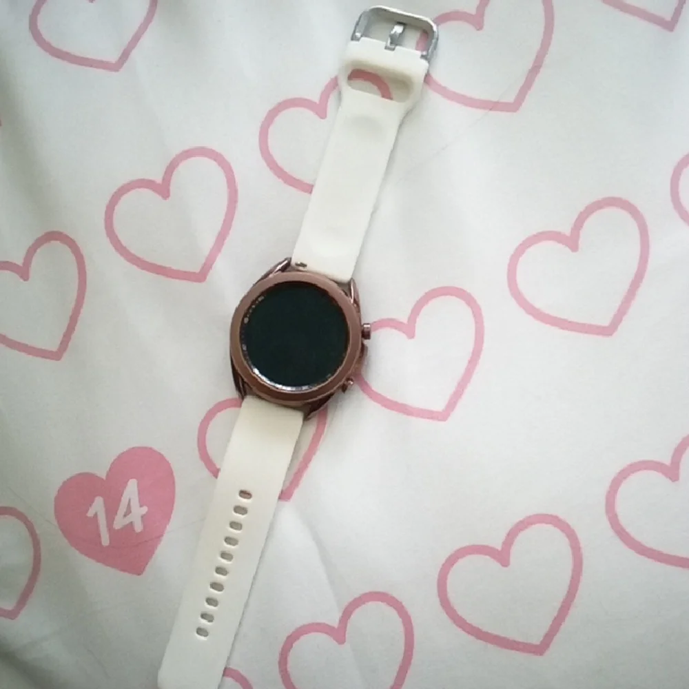 Samsung Smartwatch with White Band and Bronze Bezel